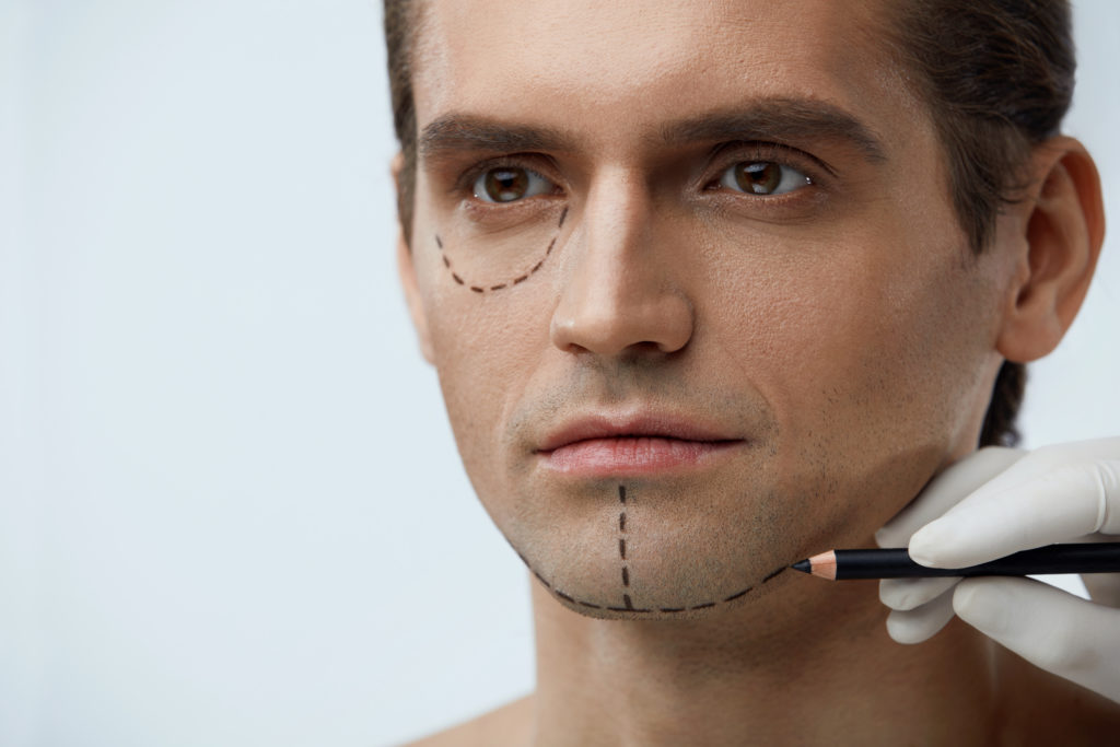 Male face prepping for plastic surgery